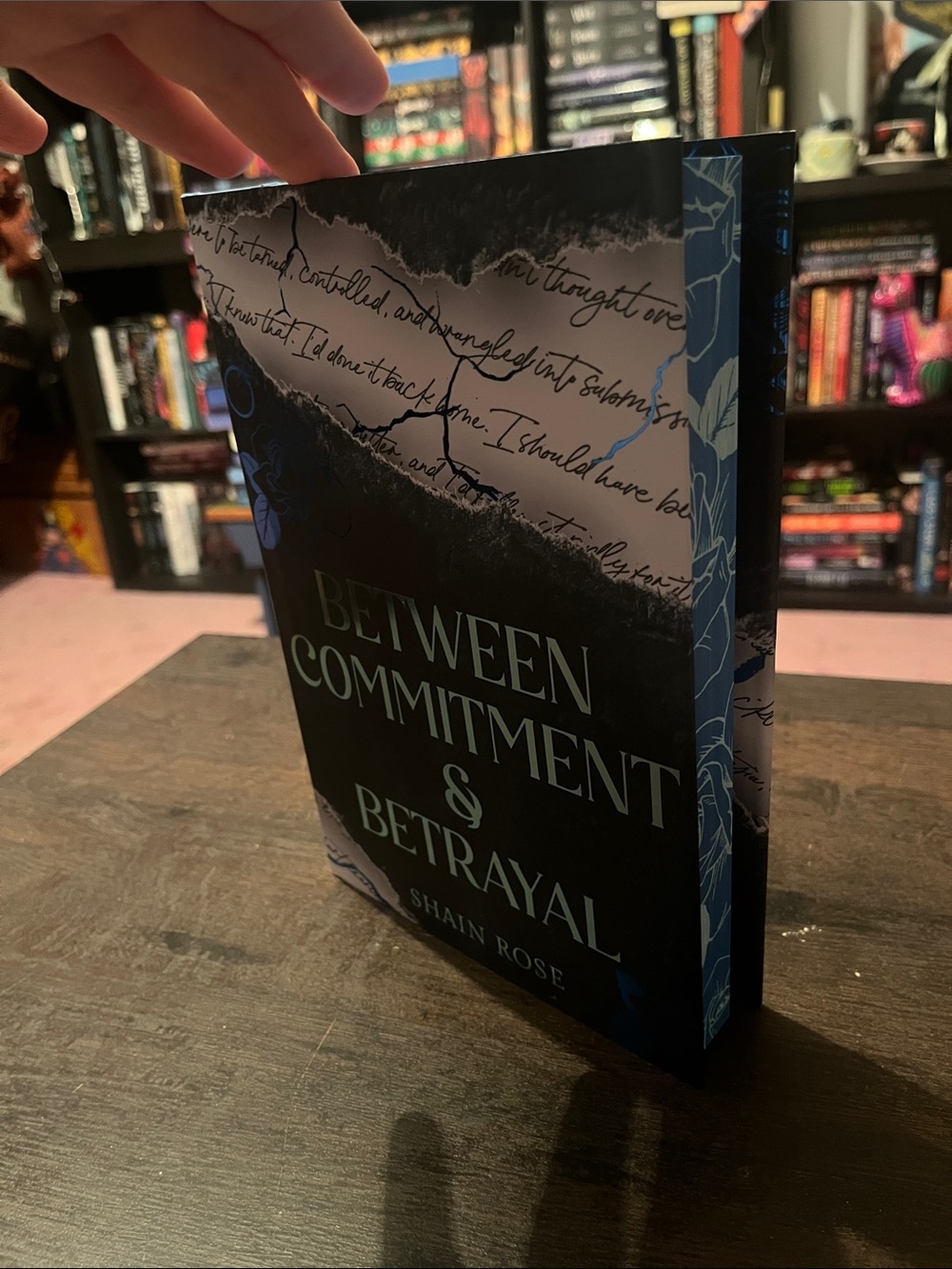 Between Commitment & Betrayal — By Shain Rose Collectors Edition Signed Sprayed